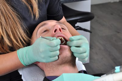 Man receiving tooth extraction