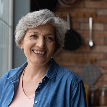 Senior woman smiling with dental implants