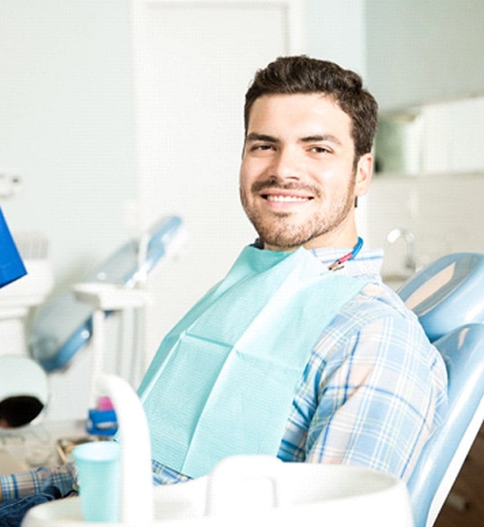 Man smiling during visit with cosmetic dentist in Simpsonville