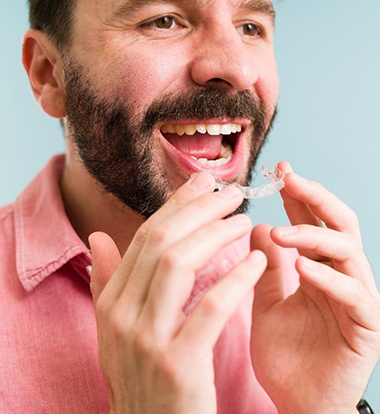 Bearded man putting in an aligner for ClearCorrect® in Greenwood, SC