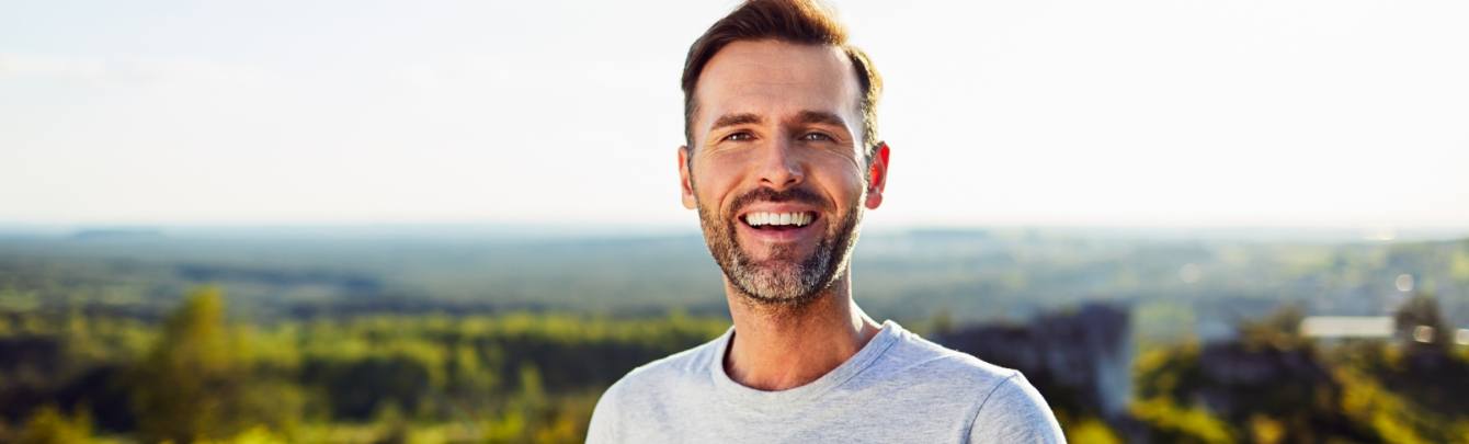 man smiling with dental bridges in Simpsonville