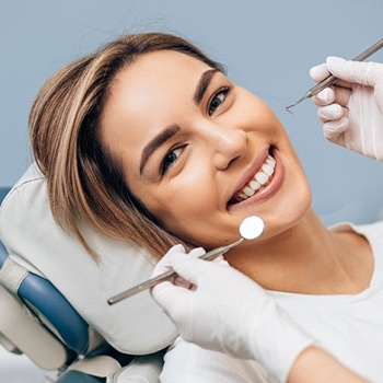 woman smiling during dental visit in Simpsonville