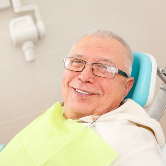 Woman smiling in a dental chair