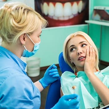 Woman with toothache visiting her Simpsonville emergency dentist