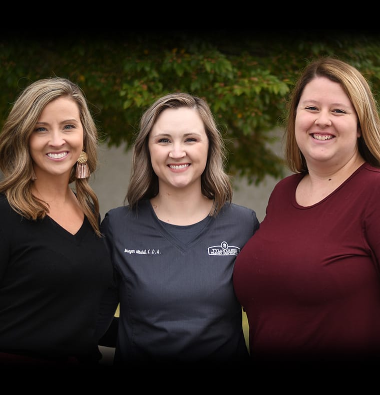 Three Greenwood dental office team members