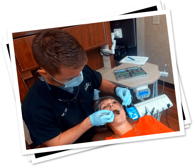 Dentist providing cosmetic dentistry treatment