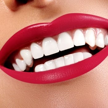 Close-up of smile with perfect teeth and red lips