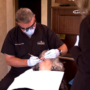 Dentist performing root canal therapy