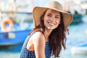 woman smiling in straw hat