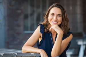 Woman smiling confidently.