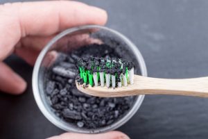 toothbrush with activated charcoal on it