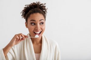 person brushing their teeth