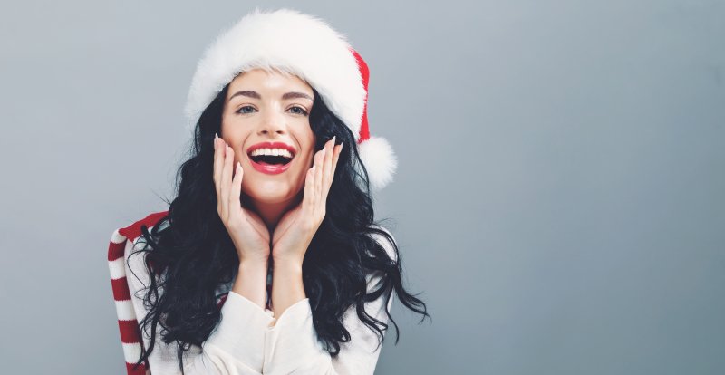 Smiling woman with Santa hat