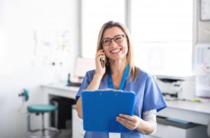 dental team member talking on the phone about dental insurance 