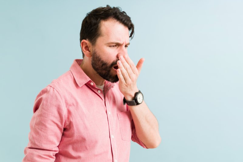 man in Simpsonville checking if his breath is bad