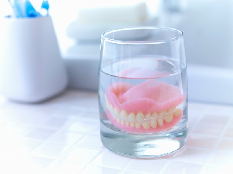 Soaking dentures in water